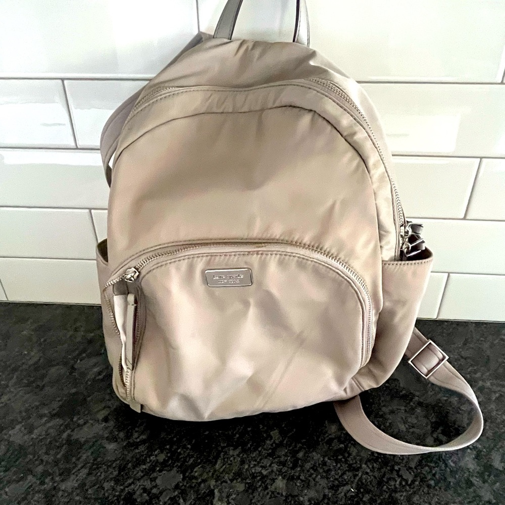 Kate spade back pack in Grey.